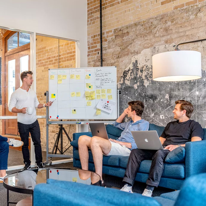 Employees discussing the benefits of a hybrid work model