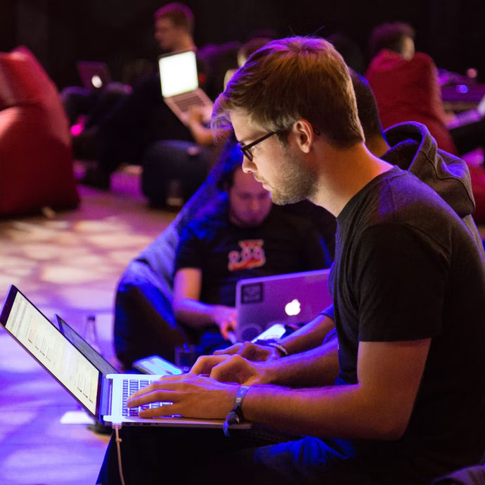 Employees running a super hackaton at an all hands meeting