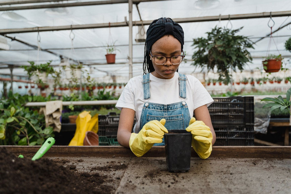 A team member planting a tree for Earth Day