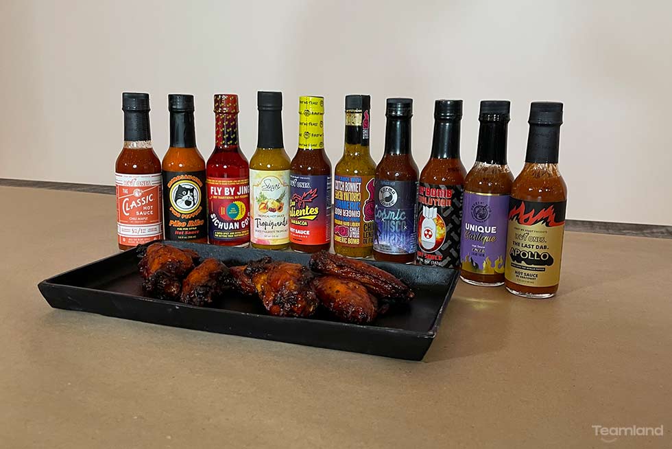 Picture of hot sauces in team building for Teamland Hot Ones hot sauce event