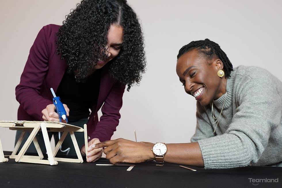 2 women doing bridge building team building