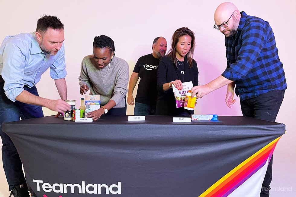 Group of people playing in Teamland food bank is right gameshow