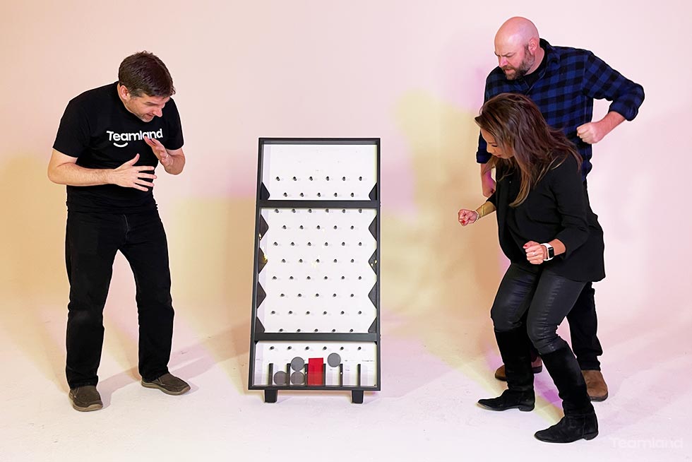 Group of people playing in Teamland food bank is right gameshow