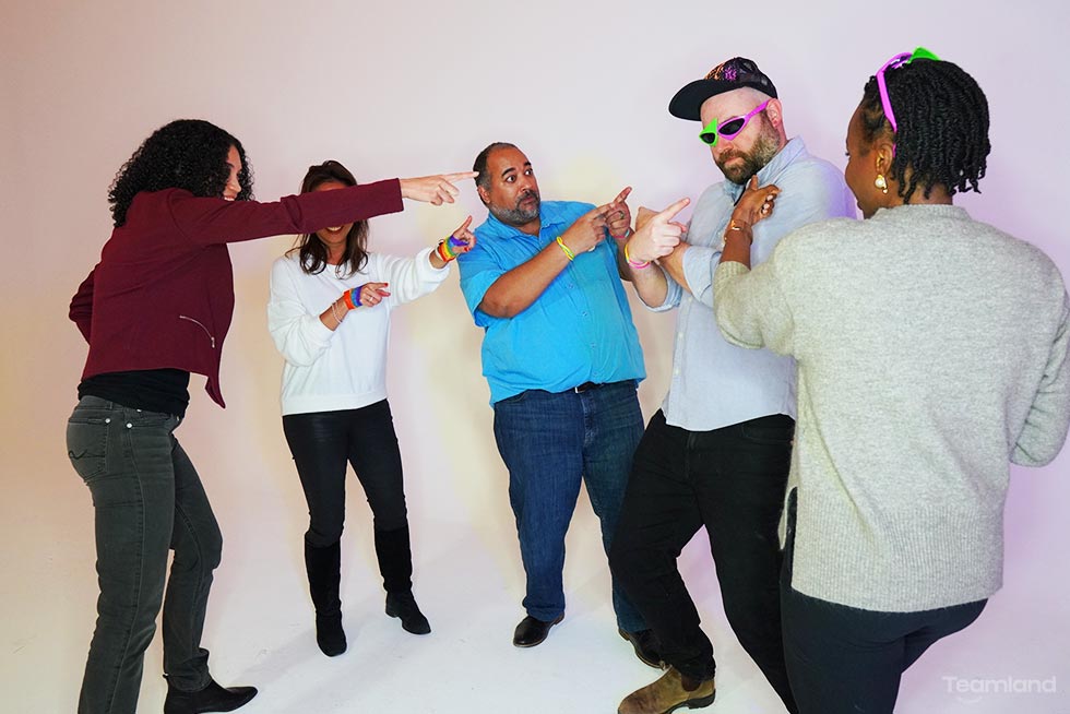 A group of people participating in Teamland Murder Mystery