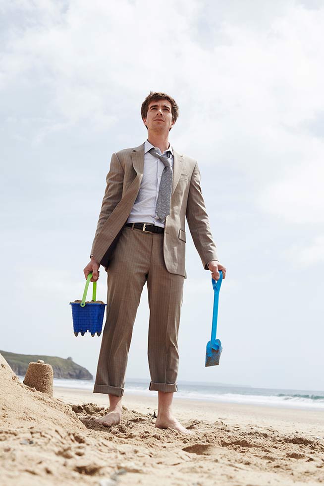 man getting ready for sand castle team building