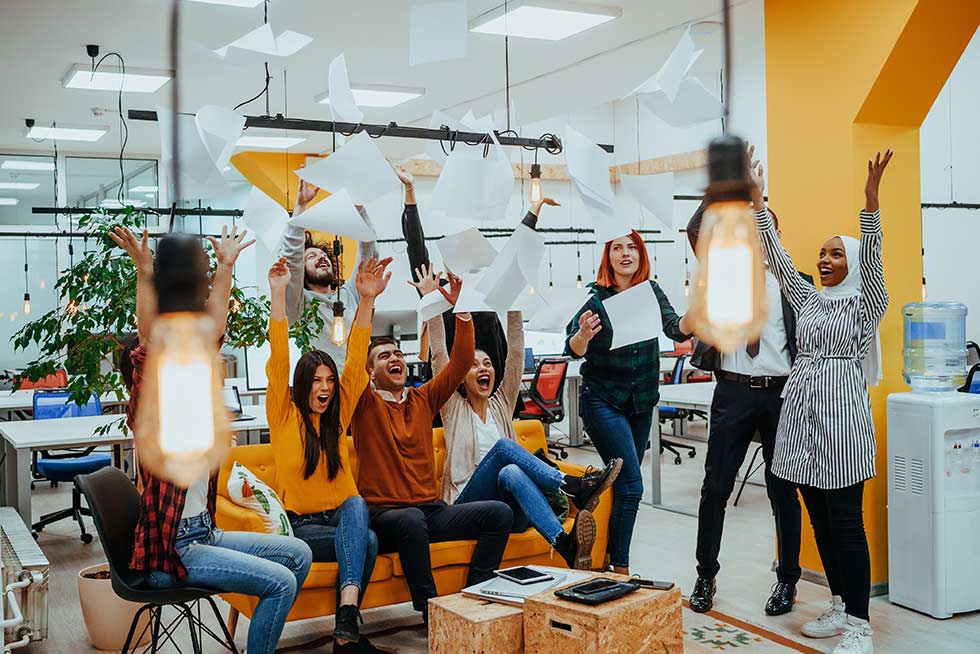A team doing 5-Minute Team Building Activities in the office