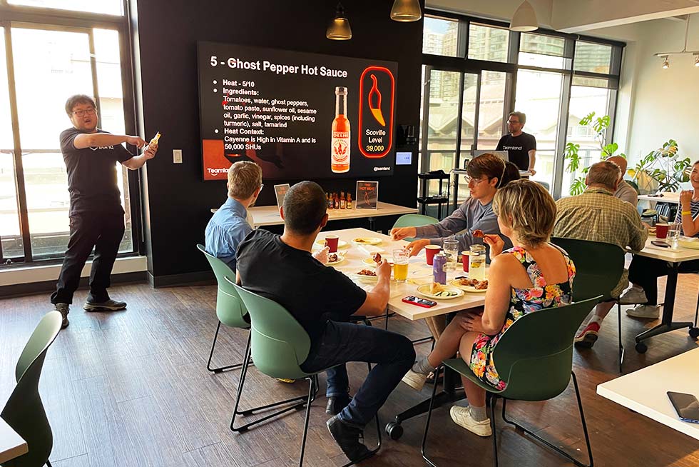 Teamland team building event with hot sauce and a group of corporate people