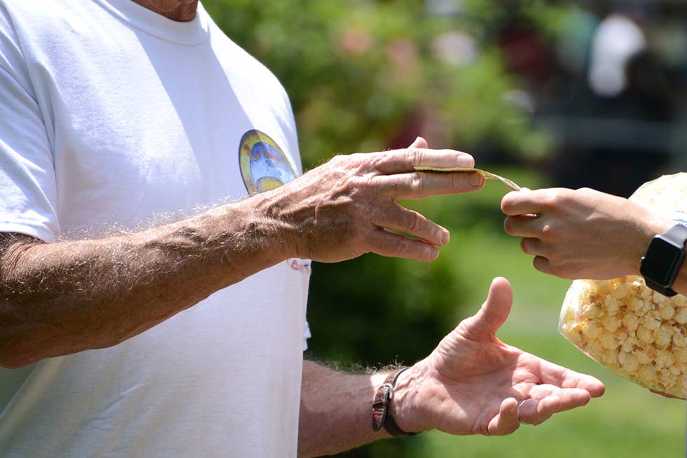 A person outdoor doing Teamland Teamopoly team building activity