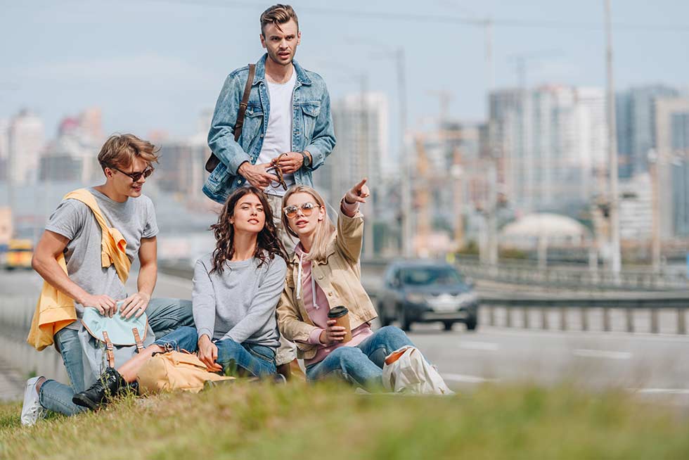 A group of people in a park outdoor doing Teamland Teamopoly team building activity