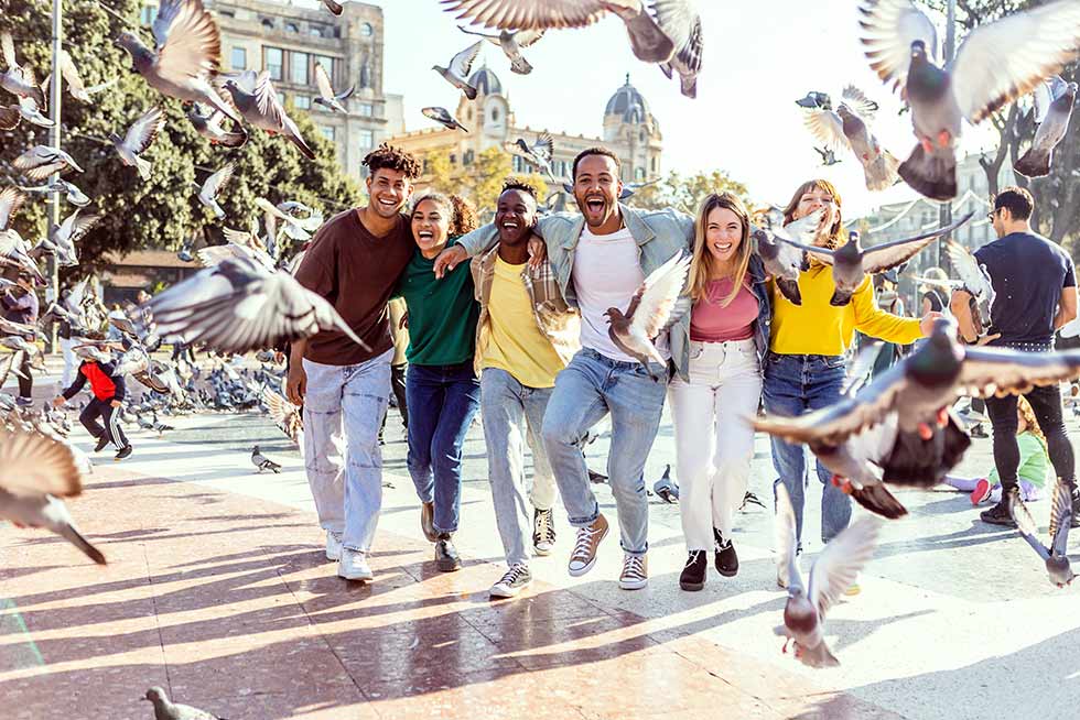 A group of people in a square outdoor doing Teamland Teamopoly team building activity