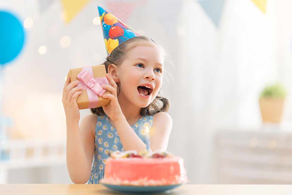 A child celebrating her birthday from Teamland