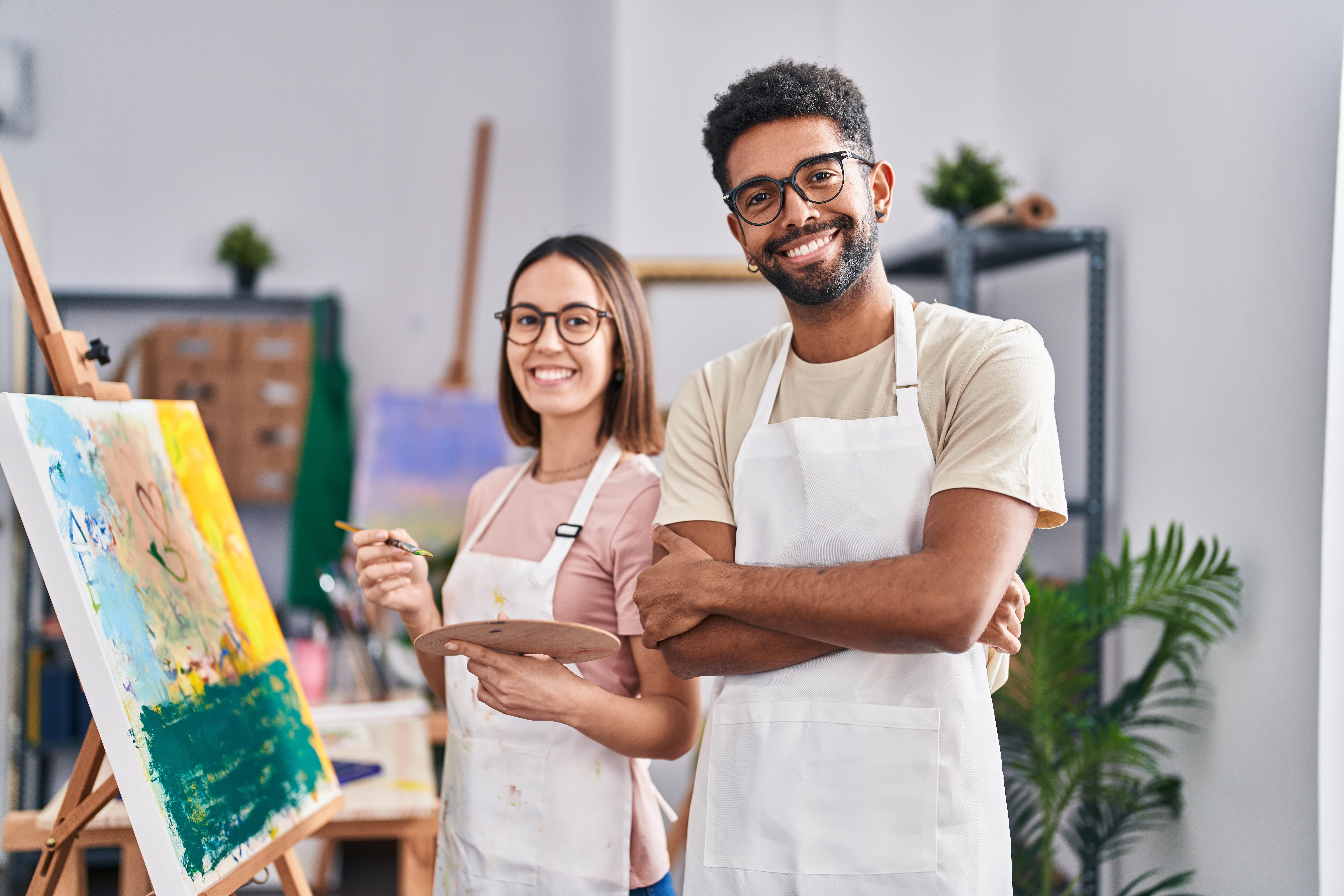 A man and a woman doing art