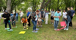 A group of people participating in a Teamland Outdoor team building activity