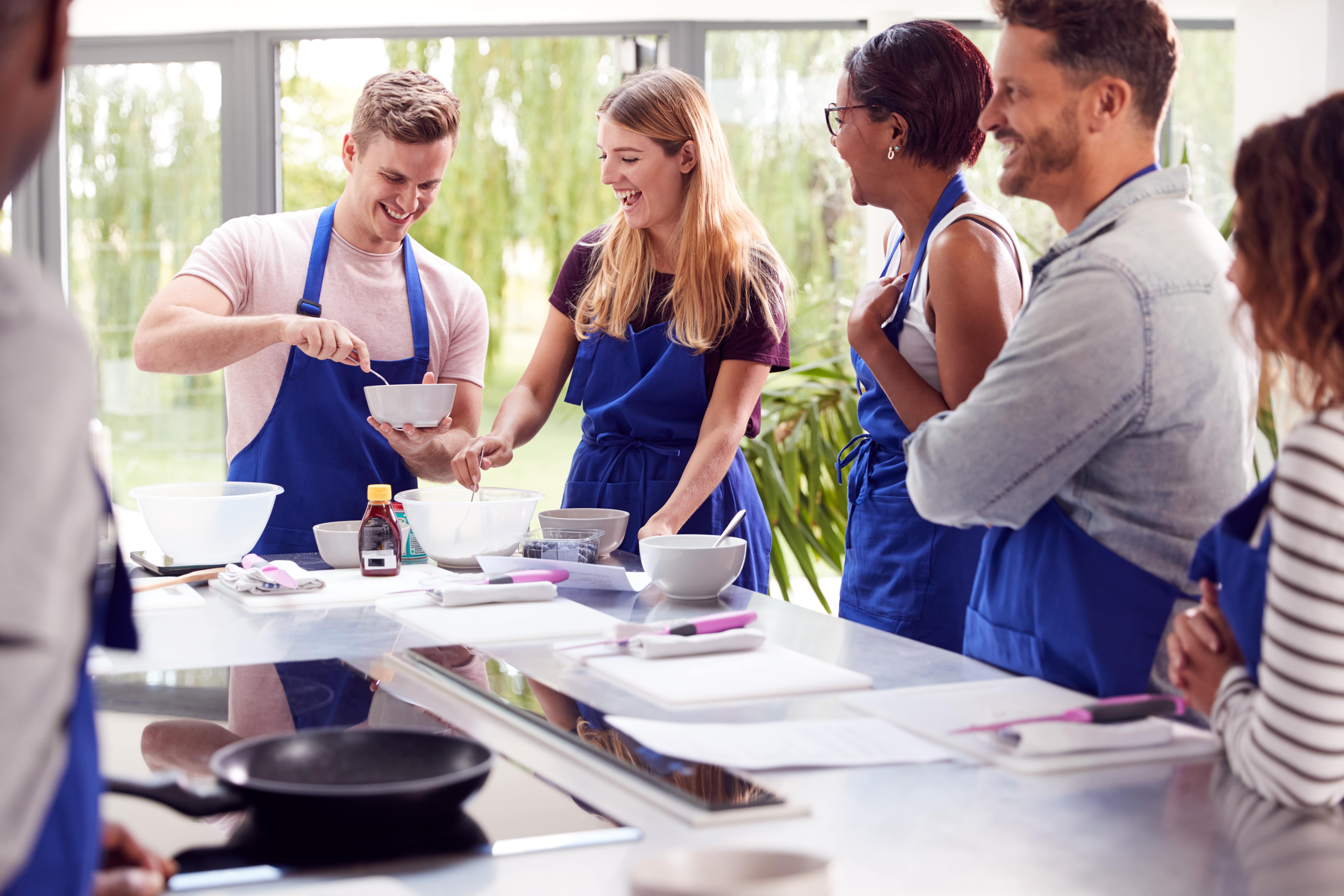 Colleagues cooking together.