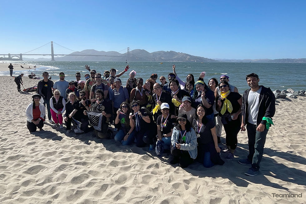 A group of people doing Teamland Amazing Race Team building with USA landscape in the background